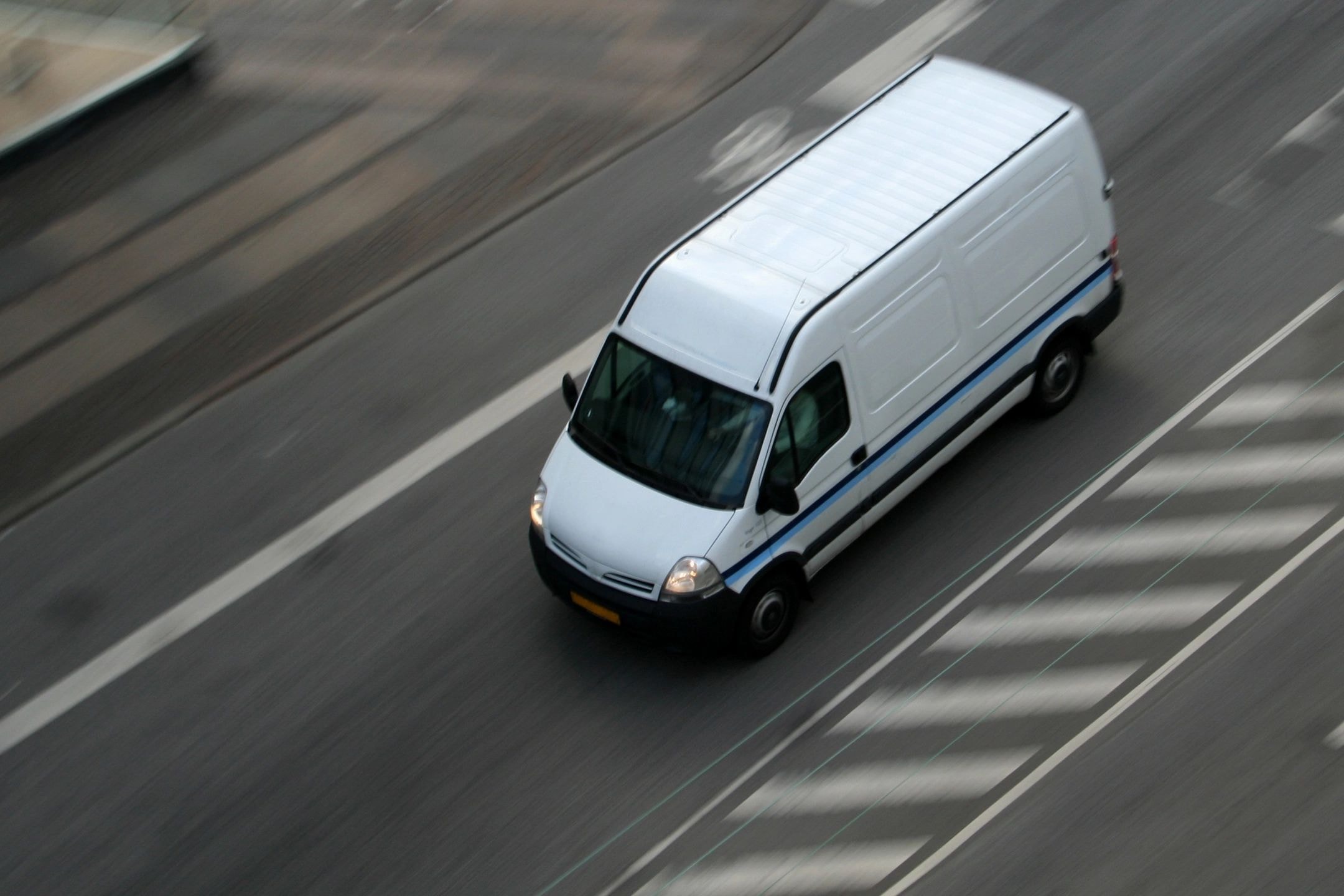 Aerial view of Vermont Tour and Charter van on highway